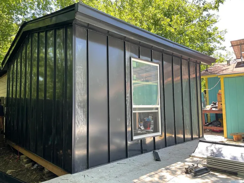 Black standing seam metal wall panels for Roof Inspection in Loveland