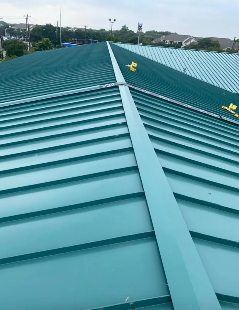 Green commercial metal roof ridge and valley for Metal Roof Repair in Loveland